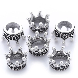 Detailed view of six silver alloy crown charms for DIY jewelry and necklaces