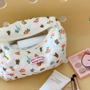 Quilted floral bear makeup bag in cream white with stay cute and keep warm tag