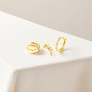 Detail of S925 sterling silver stamp on gold-plated lightning bolt and hoop earring set