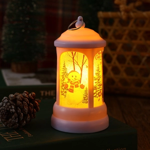 Close-up of a warm LED Christmas lantern featuring a festive snowman illustration.
