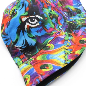 Macro shot of colorful tie-dye bucket hat with detailed tiger eye graffiti and stitching
