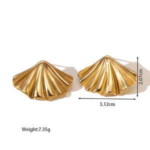 Detail view of gold ribbed scallop earrings showing 3.12cm width and 2.07cm height