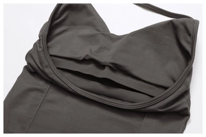 Macro detail of the built-in elastic chest band and flatlock stitching on the yoga vest