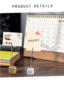 Detail of wooden card holders with metal crocodile clips and round base for desk notes