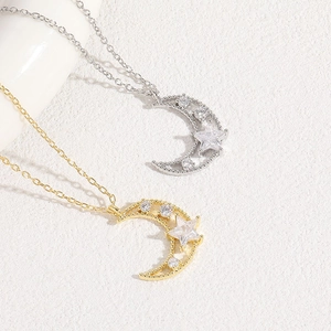 Star and moon necklace in gold and silver plating with shimmering zircon stone pendants