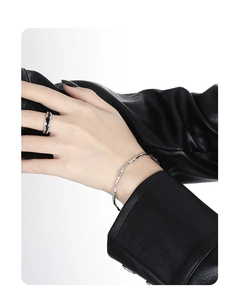 Minimalist silver S925 sterling silver bangle and ring set with unique lava texture on model