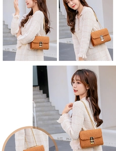 Detail view of caramel brown plush handbag featuring gold chain and metal buckle closure