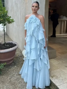 Light blue halter maxi dress with multi-layered ruffles and floral vacation style