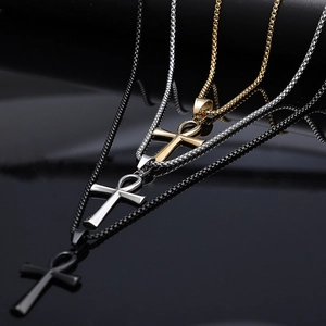 Detailed comparison of Ankh cross pendants in gold, silver, and black on box chains