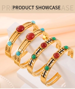 Detail of vintage gold plated titanium steel bracelets with colorful enamel stones