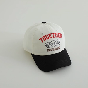 Detail of Together puppy embroidery on a contrast color cotton baseball cap for kids