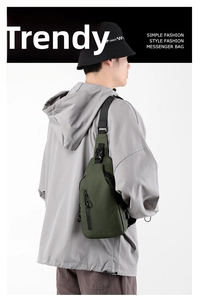 Detail of waterproof dark green canvas messenger bag with vertical zipper and buckle strap