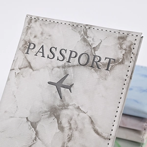 Detailed view of gray marble PU leather passport holder with precise stitching and logo
