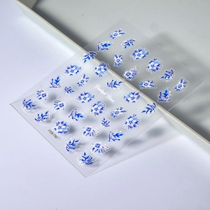 Blue and white floral nail art stickers with 3D gouache style flower patterns
