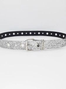 Detail of silver glitter belt with metal eyelets and double loop buckle in Y2K style