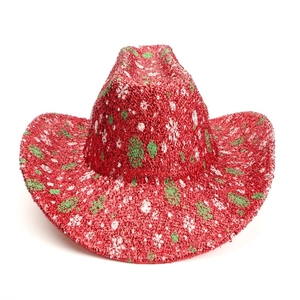 Macro detail of red Christmas cowboy hat with sparkling texture and colorful spots
