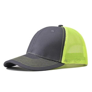 Detailed side view of grey curved brim baseball cap with fluorescent yellow mesh back