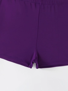 Detailed view of stitching and quick-dry elastic fabric on dark purple swim shorts