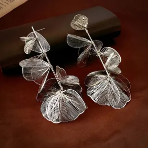 Exquisite silver hollow flower tassel drop earrings in metallic wire mesh design