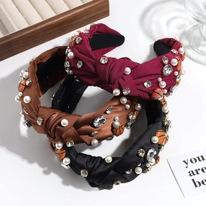 Vintage knotted headbands with basketball motifs, rhinestones and pearls on white background