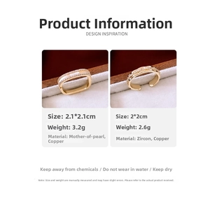 Detail view of 14K gold plated rings with white shell inlay and zircon stone accents