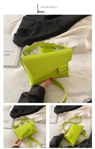 Detail view of neon green PU leather crossbody bag with asymmetric flap and buckle