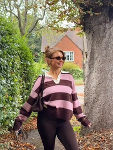 Women's pink and brown striped polo knit sweater with loose drop shoulder fit