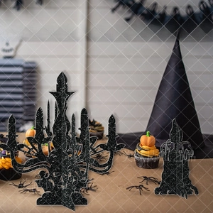 Close-up of black glitter Halloween candle holder decorations for festive table decor