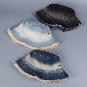 Three gradient denim bucket hats featuring distressed frayed edges and metal side labels
