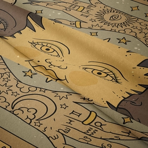 Detail of bohemian tapestry featuring astrology symbols, moon, sun and zodiac signs