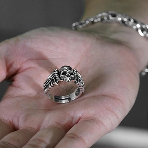 Retro punk style skull and wings silver ring with adjustable open design on hand