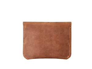 Detailed view of brown crazy horse leather card holder with precise side stitching