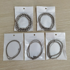 Detailed view of five waterproof stainless steel bead necklaces in clear packaging