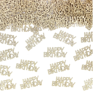 Close-up of golden glitter Happy Birthday confetti scattered on a clean white background