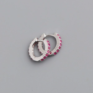 Macro shot of S925 sterling silver hoop earrings with micro-set pink cubic zirconia