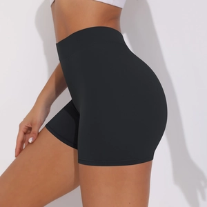 Close-up of high-waist black yoga shorts showing peach lift and seamless fabric detail