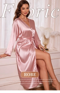 Detail of pink silk satin long robe with a belted waist and elegant V-neck design