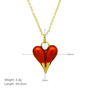 Detail view of red heart pendant necklace with 20x33mm dimensions and 45cm gold chain
