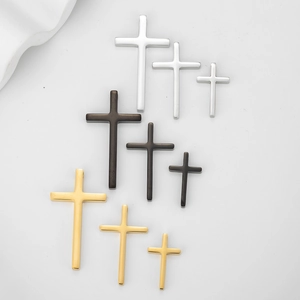 Polished stainless steel cross pendants in gold silver and black with three size options