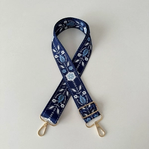 Adjustable 38mm wide dark blue canvas shoulder strap with white and blue floral embroidery