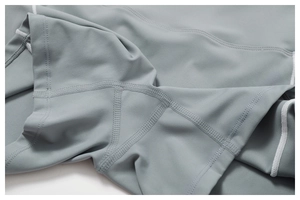 Macro detail of high-quality flatlock stitching on breathable yoga leggings fabric