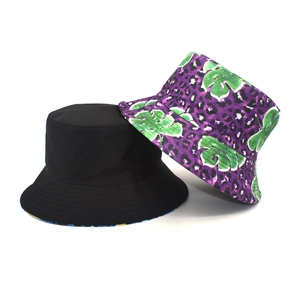 Detail showing classic black and purple leopard monstera print reversible bucket hats