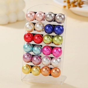 Set of 12 pairs multi-colored faux pearl stud earrings displayed on a transparent stand