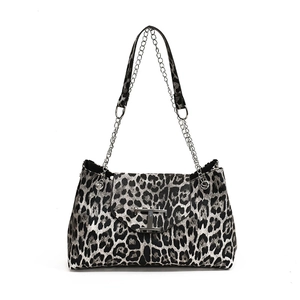 Leopard print chain shoulder bag with black and white animal pattern and silver hardware