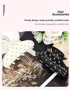 Detail view of large hair claw clips with plaid pattern and sparkling rhinestones