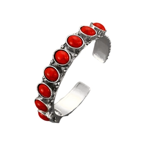 Vintage bohemian open bangle featuring red turquoise inlay and antique silver finish