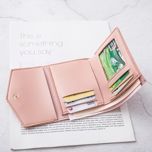 Minimalist light pink tri-fold PU leather wallet with card slots and metal snap button