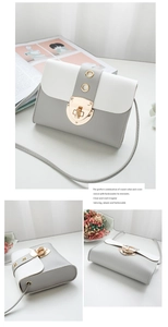 Detail of grey and white PU leather crossbody bag with golden metal rotating lock