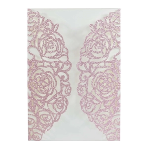 Macro view of pink glitter laser cut lace rose pattern on wedding invitation cover