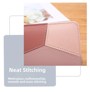 Close-up of neat stitching and geometric color-block leather on pink wallet